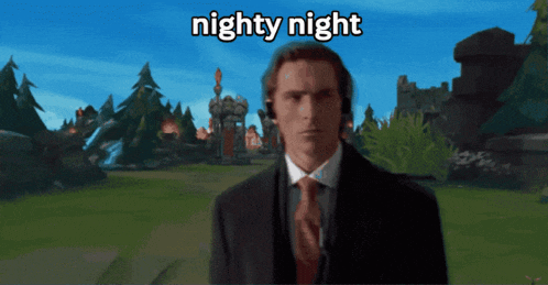a man in a suit and tie stands in front of a screen that says nighty night on it