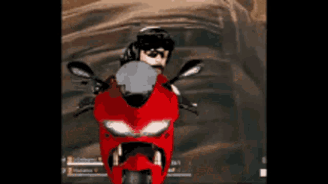 a man in a helmet is riding a red motorcycle