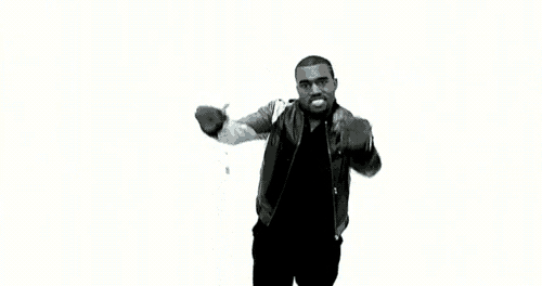 a man with his arms outstretched surrounded by blue diamonds