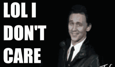 a man in a suit and tie is standing in front of a sign that says loli don t care .