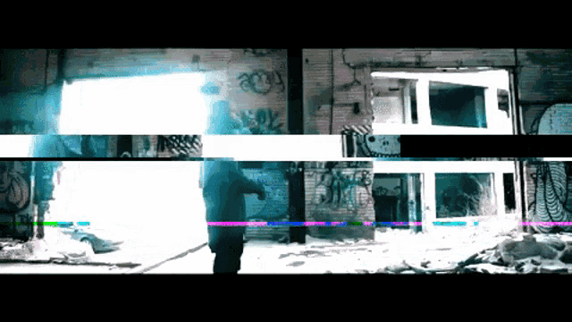 a blurry picture of a building with graffiti on the walls and the word amy on it