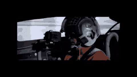 a group of tie fighter jets are flying in the air .