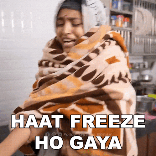 a woman wrapped in a blanket with the words " haat freeze ho gaya " on the bottom