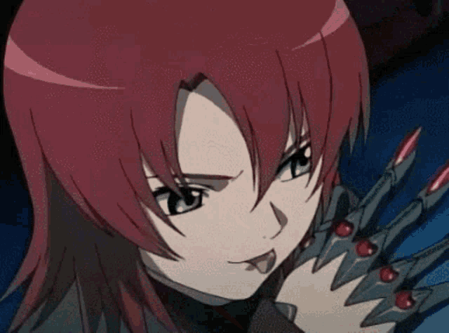 a girl with red hair is wearing a black glove with red nails on it