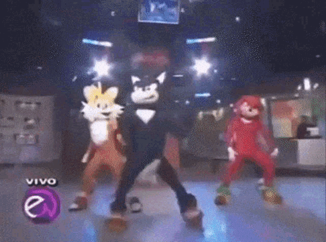 sonic the hedgehog tails and knuckles are dancing in a disco