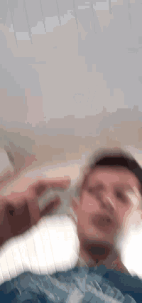a blurry picture of a person 's face with a white background .
