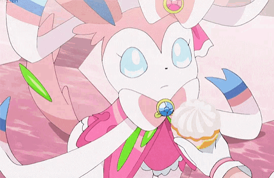 a pink and white cartoon character is holding a cupcake in her hand