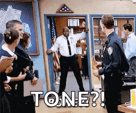 a man in a white shirt and tie is standing in a doorway in front of a group of people with the word tone written on it