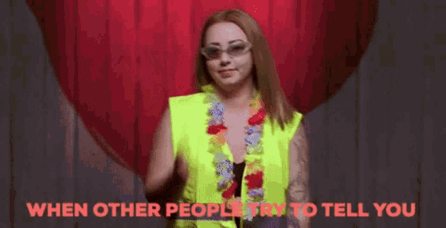 a woman wearing sunglasses and a yellow vest with the words " when other people try to tell you " above her