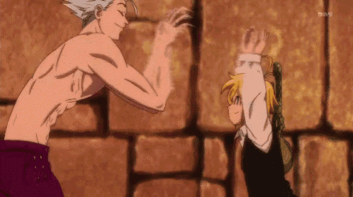 a man without a shirt is standing next to a boy with his hands up