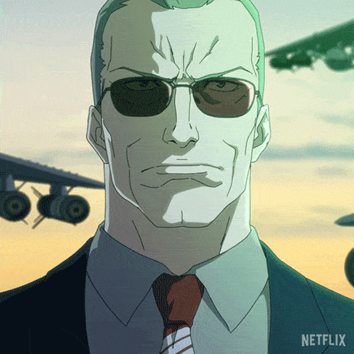 a man wearing sunglasses and a suit has a netflix logo behind him