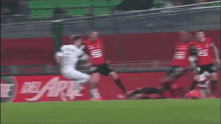 a soccer player wearing a number 13 jersey kicks a ball
