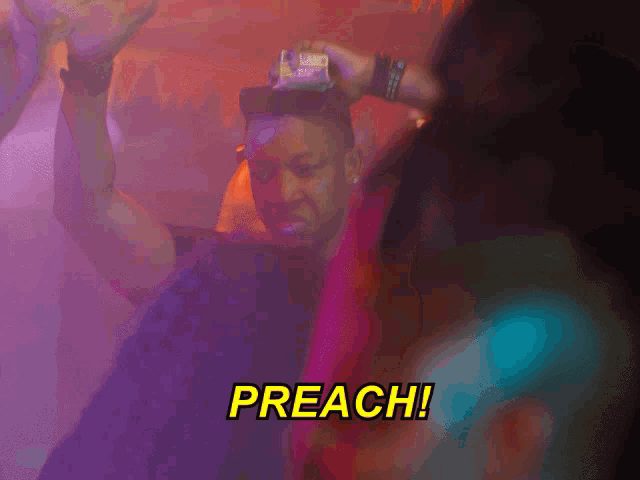 a man in a club with the word preach written in yellow