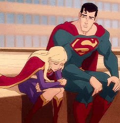 a man in a superman costume is hugging a little girl