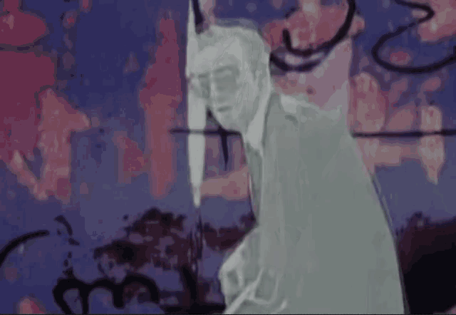 a man in a suit and tie is standing in front of a wall with a painting on it .