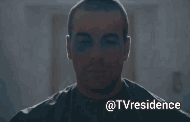 a man with a black eye is smoking a cigarette with the words @tvresidence above him