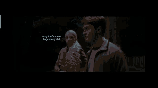 two men are looking at each other with the words " you 're beautiful draco " on the screen
