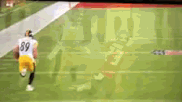 a football player with the number 89 on his jersey is being tackled by another player