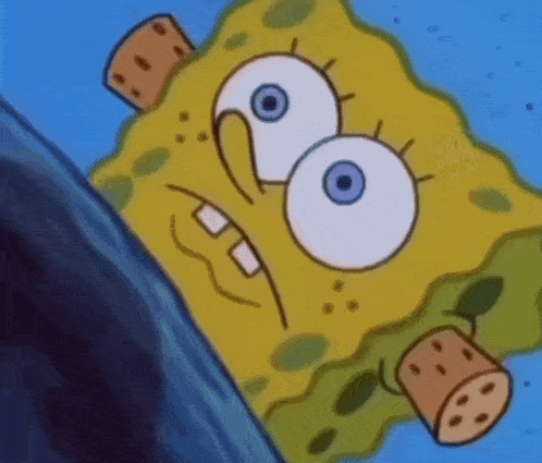 a close up of a cartoon character , spongebob squarepants , with a bottle in his mouth .