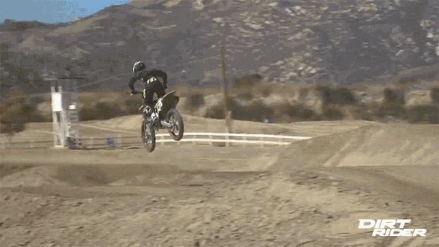a dirt rider poster shows a person on a dirt bike