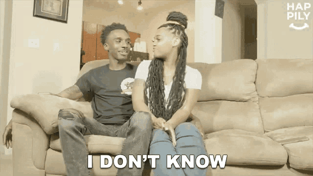 a man and woman are sitting on a couch and the woman is saying i don 't know