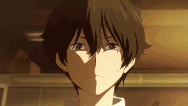 a close up of a person 's face with a shadow behind them