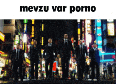 a group of men in suits and ties are walking down a street with the words mevzu var porno written above them