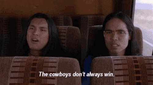 a man and a woman are sitting on a bus with the words " the cowboys don 't always win "