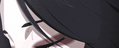 a close up of a woman 's eye with a shadow on her eyebrow