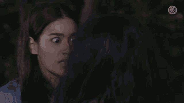 a woman with a surprised look on her face is looking at another woman