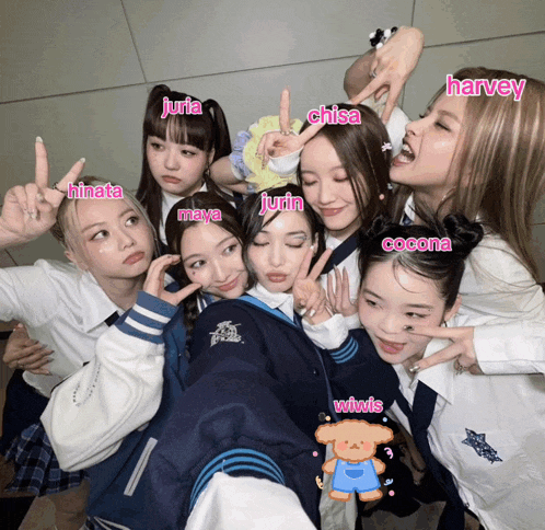 a group of girls are posing for a picture with their names written in pink