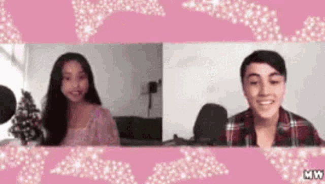 a boy and a girl are talking to each other on a pink background .