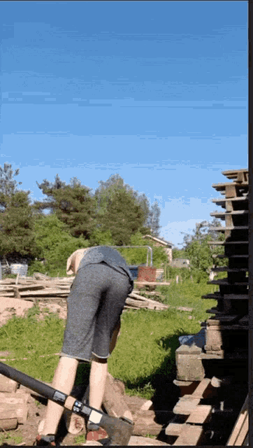 a man is digging in the dirt with a shovel that says ' sd ' on it