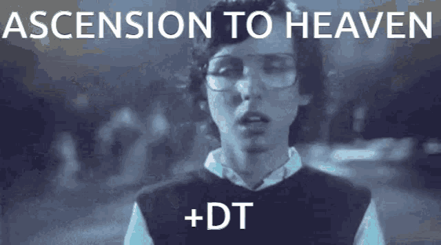a man wearing glasses and a black vest says ascension to heaven + dt