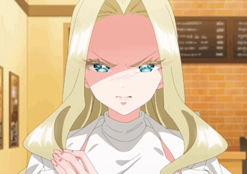 a woman with blonde hair and blue eyes is making a funny face