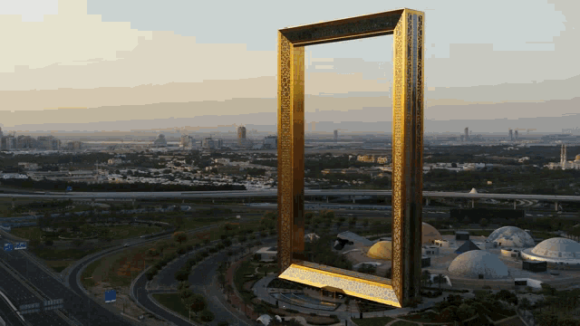 a picture frame in the middle of a city with a city in the background