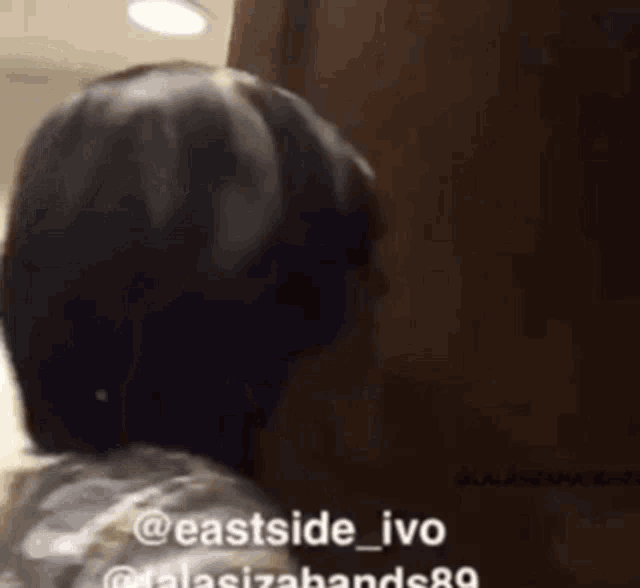 a woman is talking on a phone with the name eastside_ivo on the bottom