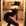 a blurry picture of a person standing in front of a door in a room .