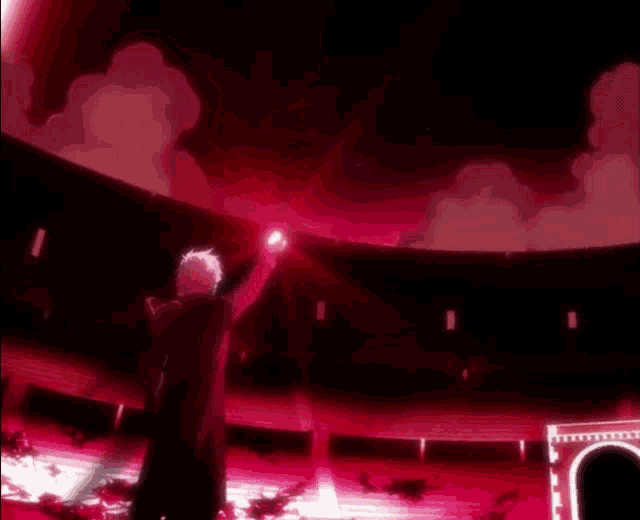 a man is standing in a dark room with a red light coming out of his hands