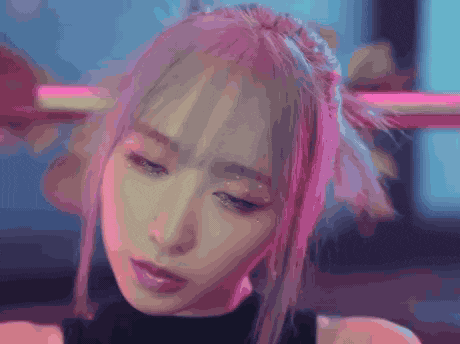 a close up of a girl with pink hair
