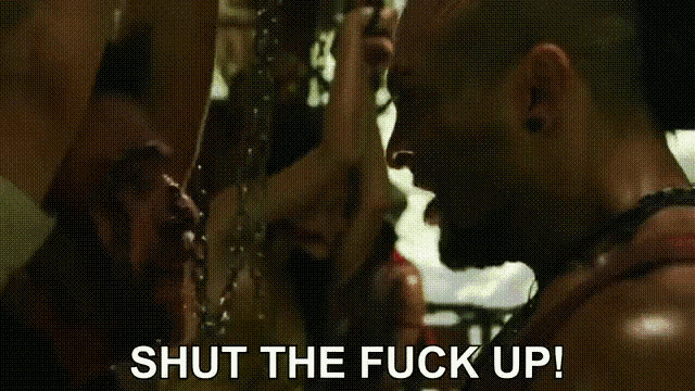 a man drinking from a bottle with the words shut the fuck up written on the bottom