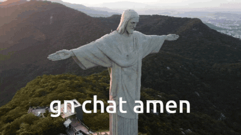 a statue of jesus on top of a mountain with the words grchat amen written below it
