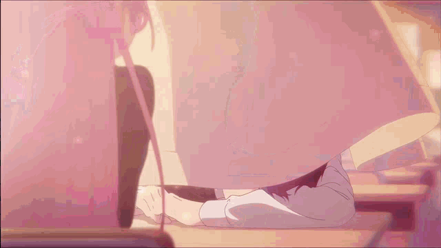 a person laying on a desk with their head on it