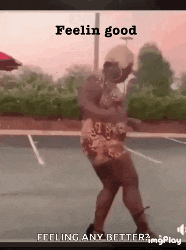 a man is dancing on a basketball court with the words feelin good on the bottom