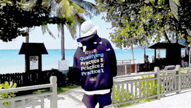a person wearing a black hoodie that says qualifying practice 3 practice 2 practice 1
