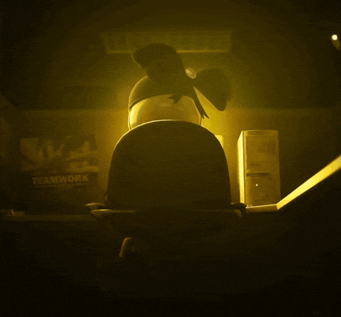 a poster in a dark room says teamwork