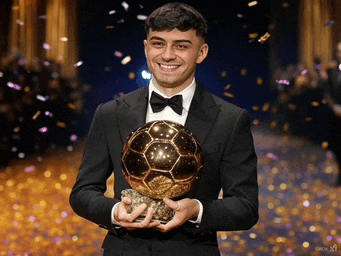 a man in a tuxedo holds a soccer ball in his hands