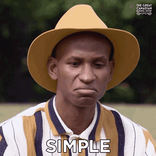 a man wearing a yellow hat and a striped shirt says simple .
