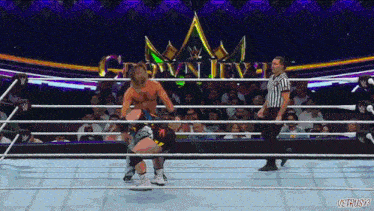 a man in a wrestling ring with the words crown jewel above him