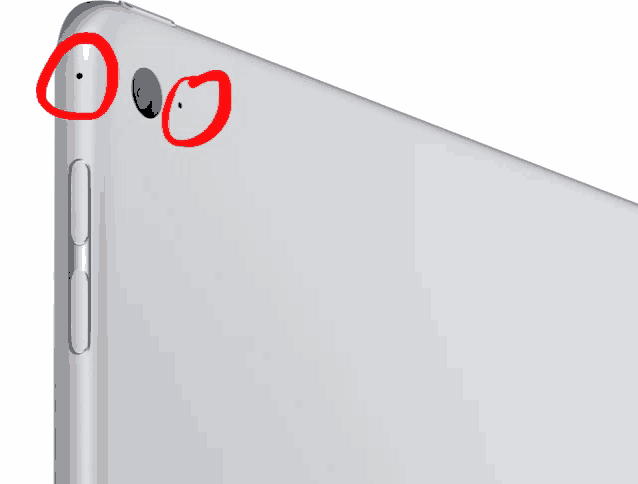 a close up of the back of an ipad with two red circles around the camera